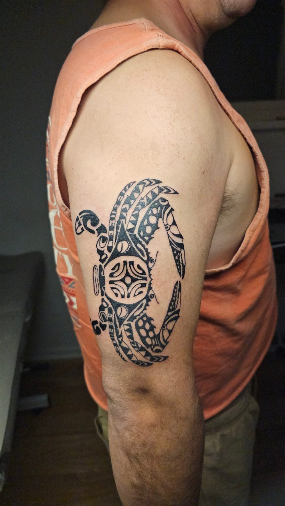Polynesian-style crab tattoo on an upper arm by Jungle Earth Tattoos