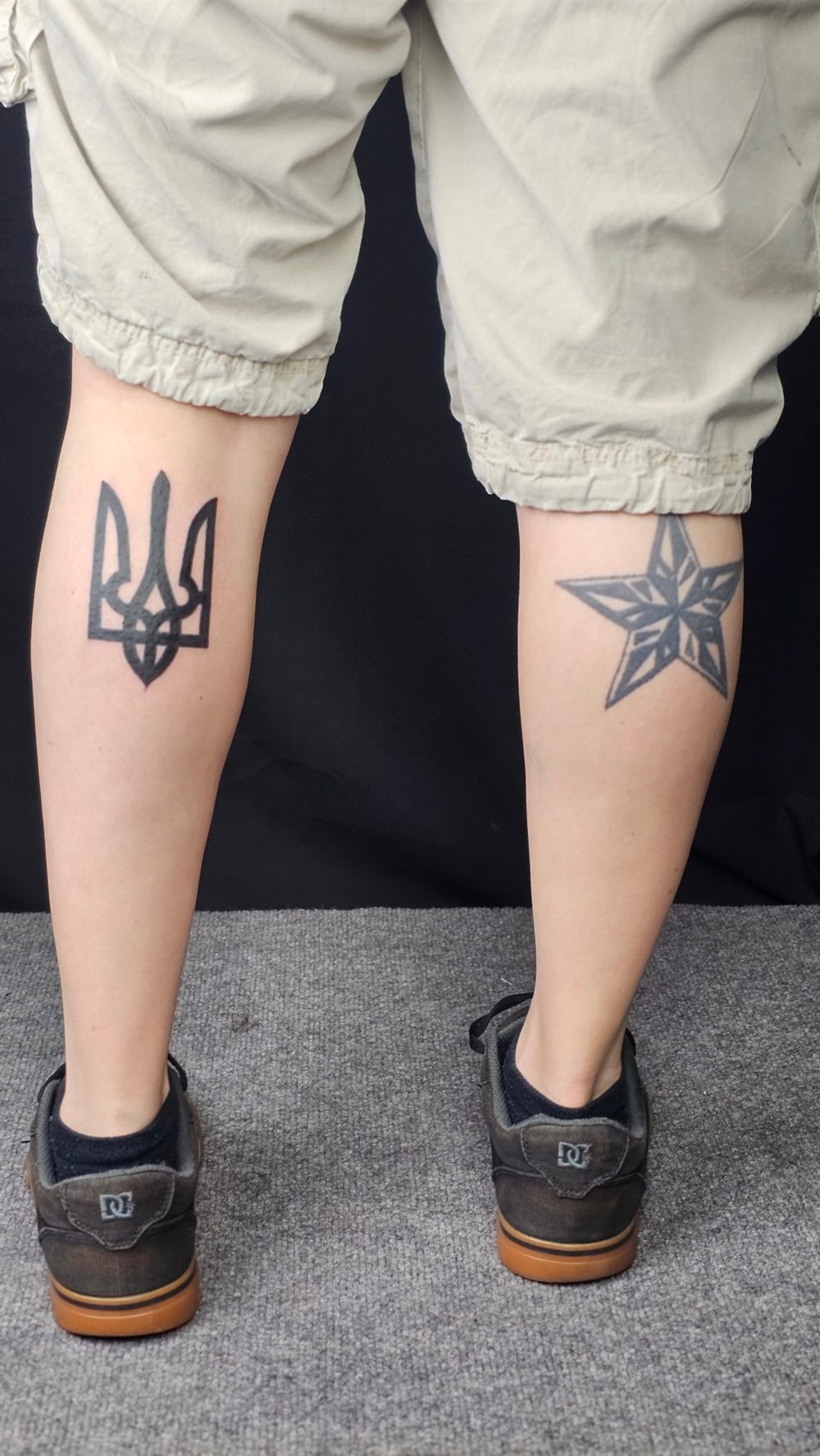 Trident tattoo and geometric star tattoo on the backs of two calves by Jungle Earth Tattoos